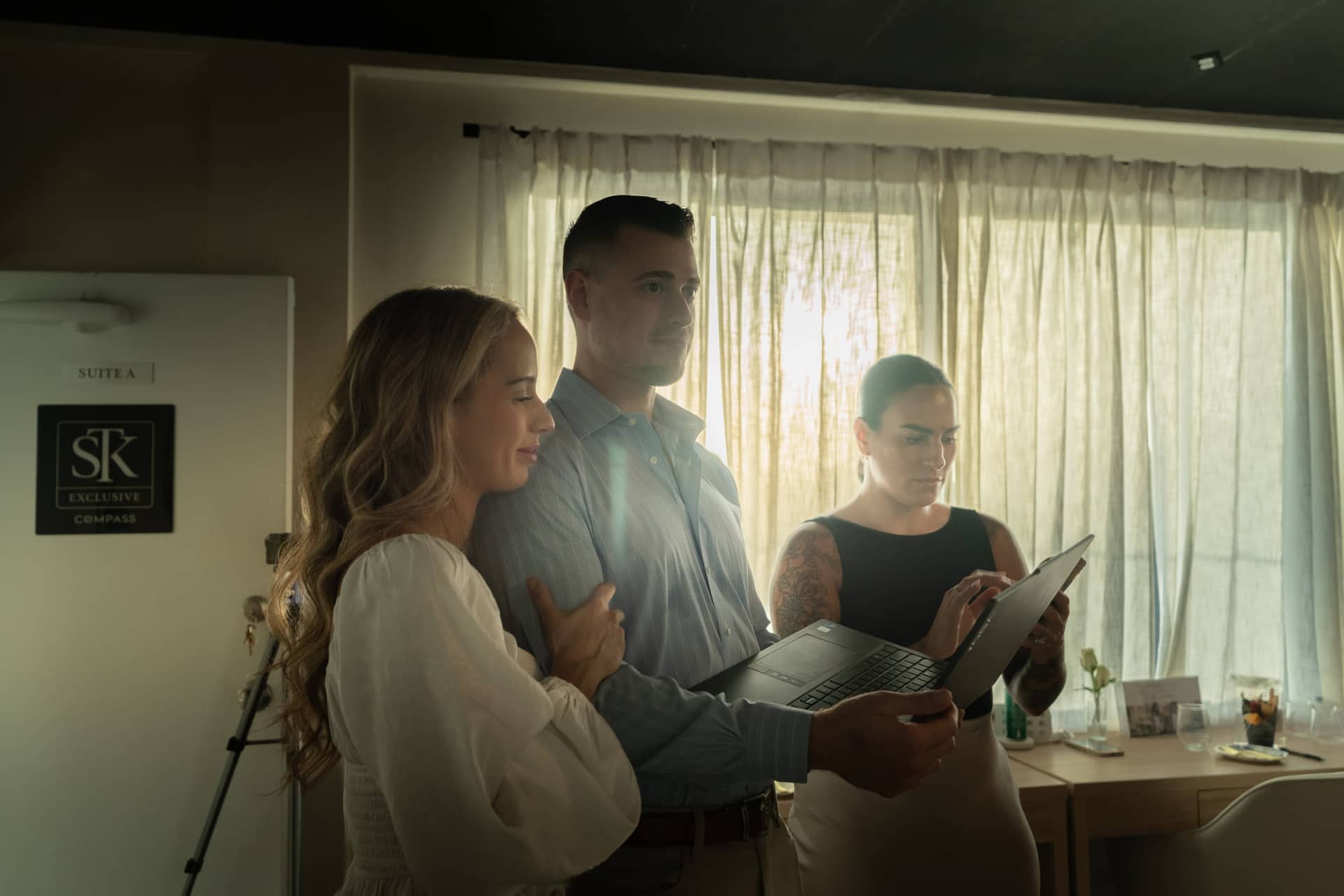 Christopher Molina with guests in soft window light at a Lunch and Learn